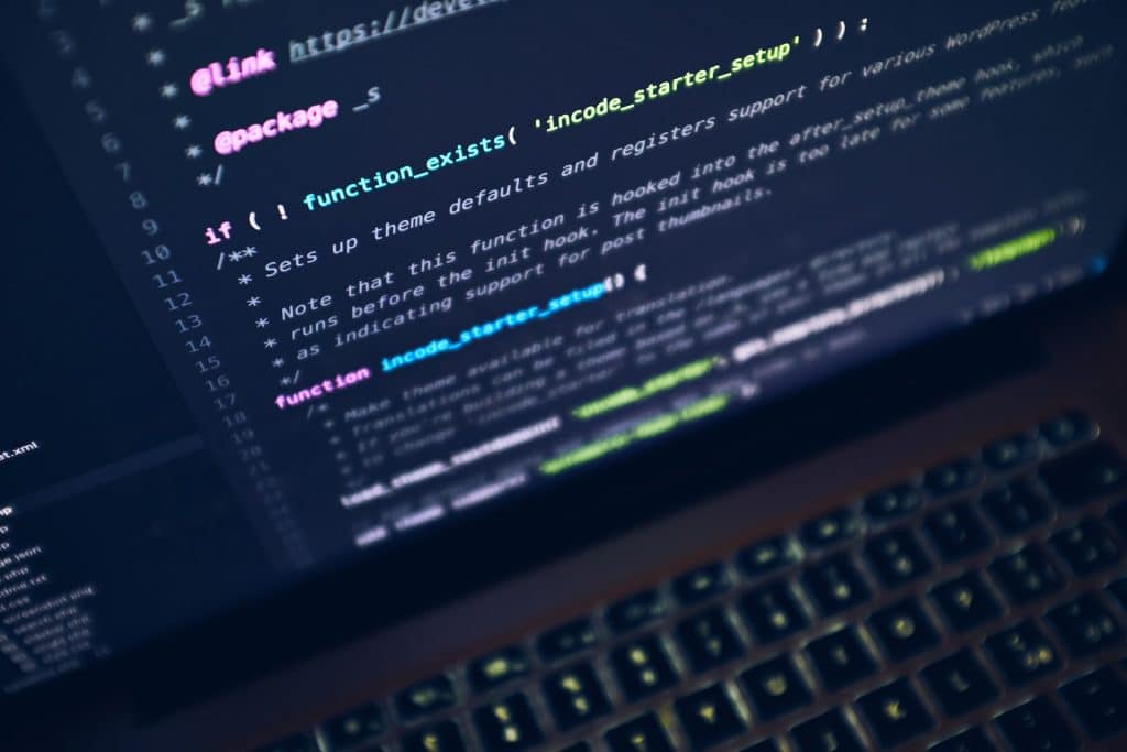 A close up of a computer screen with complex coding script