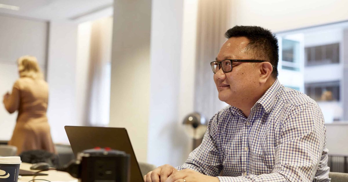 man using Microsoft 365 on laptop for document management