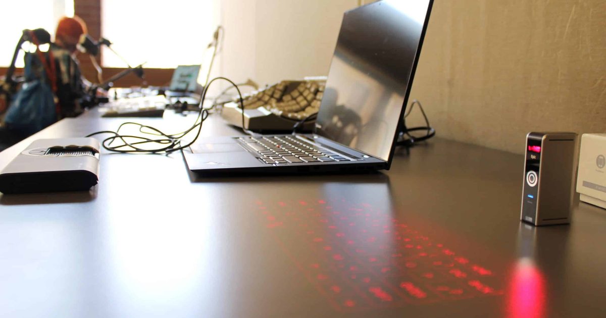 Banner image for screen reader blog post displays an open laptop with assistive technology