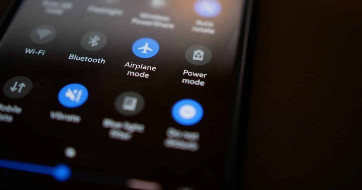 A phone against a dark background showing the settings, the airplane mode button turned on to show the power of taking power apps offline